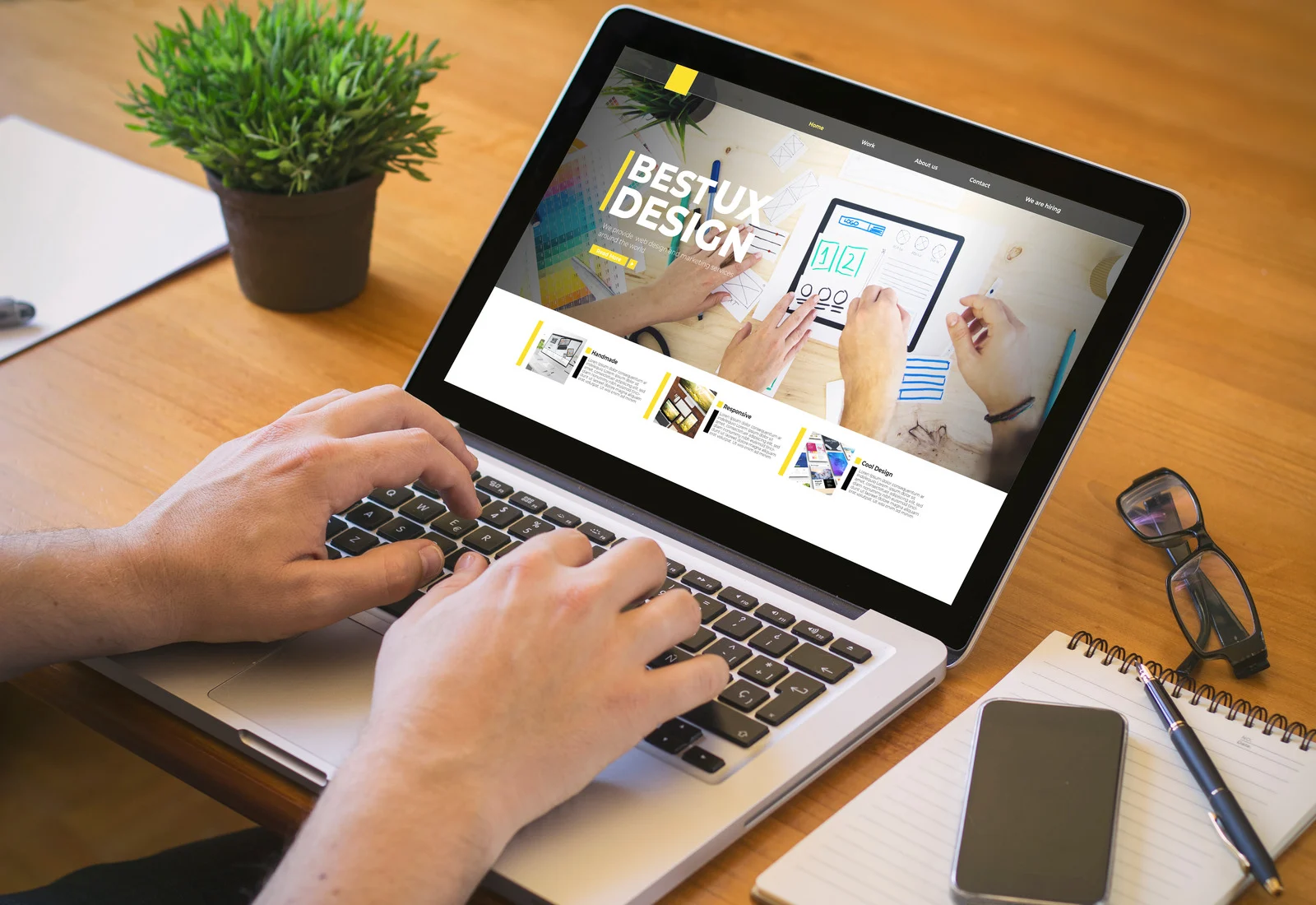 Person browsing UI/UX design examples on a laptop, illustrating the role of user interface and experience in effective medical website design strategies - Wolf IQ