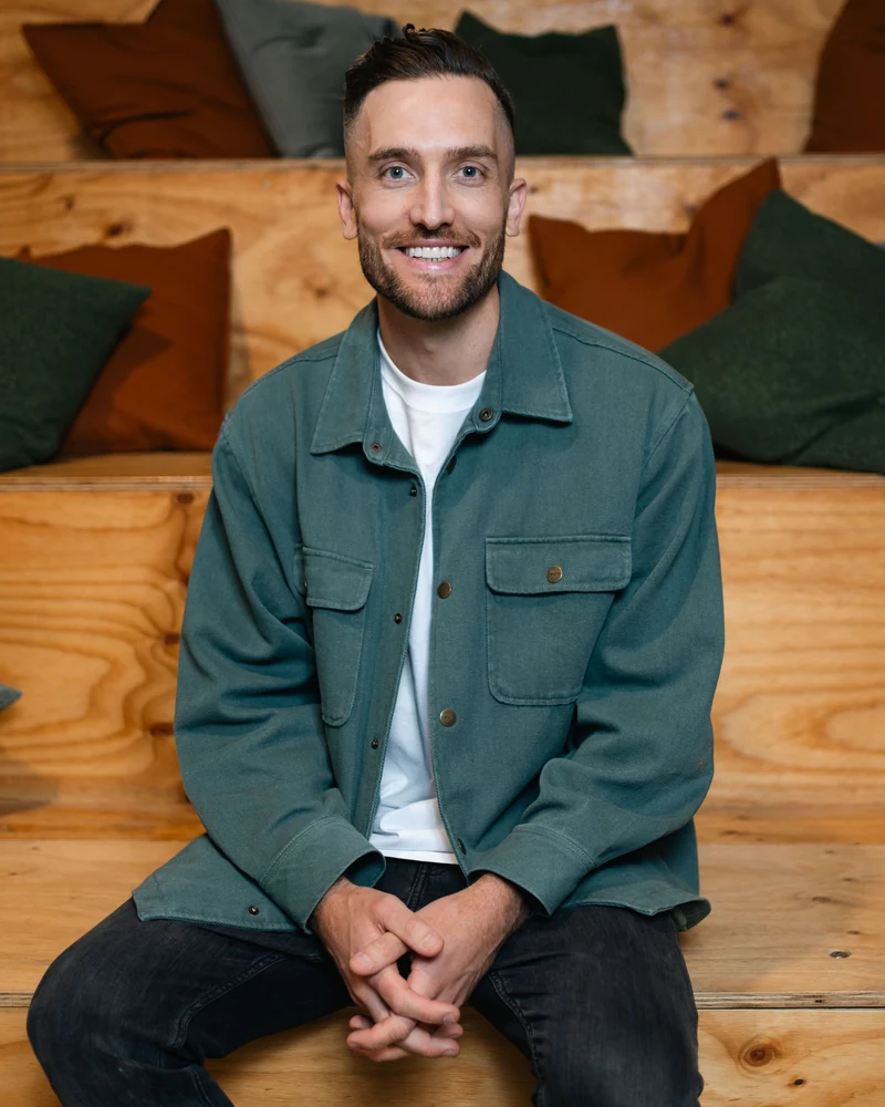 Andy Crebar on the plywood steps at the Wolf IQ office