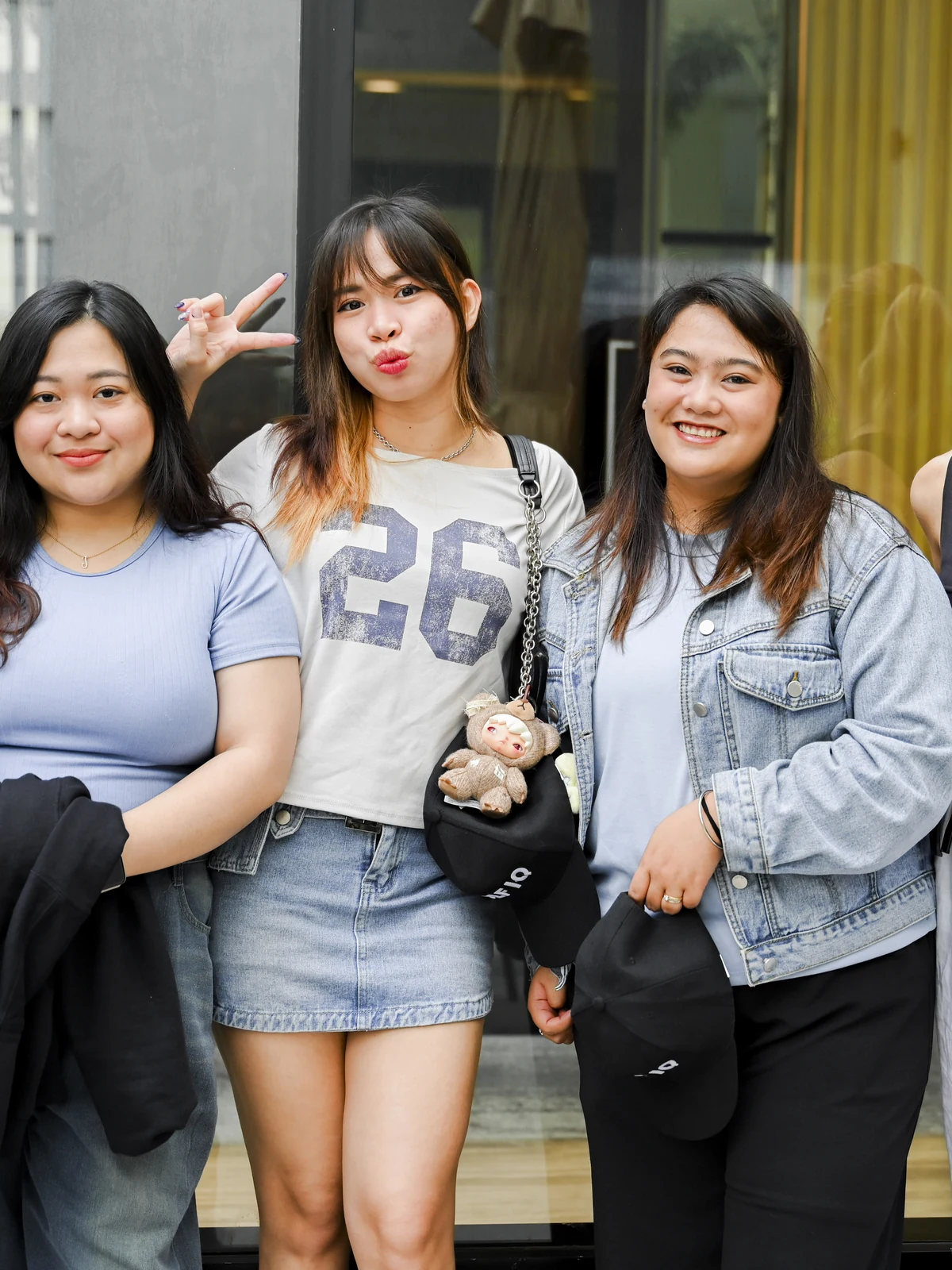 Four Wolf IQ team members outside the Manila office, relaxed and smiling